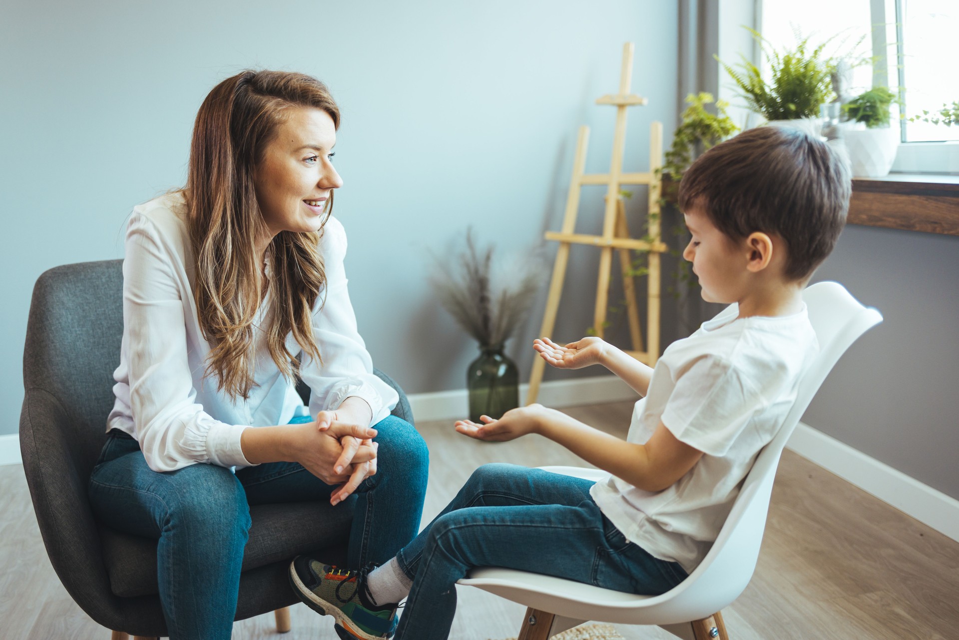Young boy having therapy with a child psychologist.